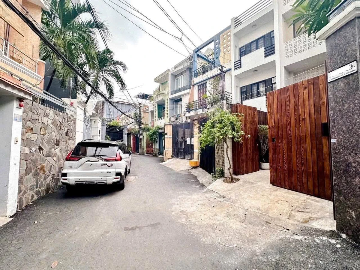 Bán tòa nhà 5 tầng 116m2 nở hậu, hẻm nhựa 6m gần Lê Quang Định, Bình Thạnh - Ảnh 1